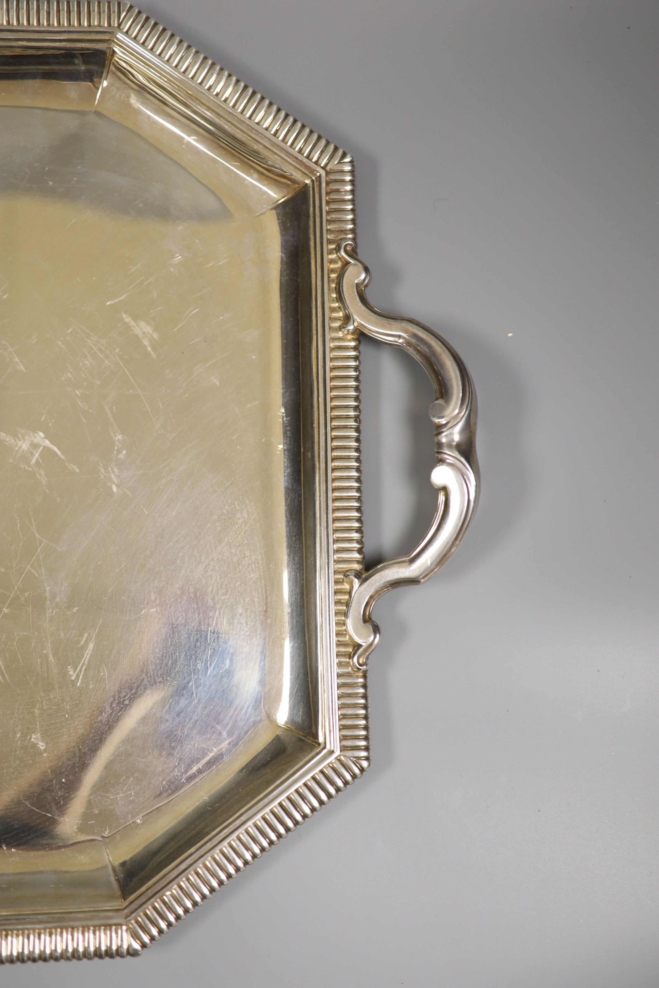 A 20th century French 950 standard white metal two handled tea tray by Emile Puiforcat, 64.5cm over handles, 132.5oz.